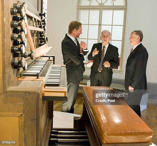 German President Horst Koehler , mayor of Leipzig, Burkhard Jung and director of the Bach Archive, Christoph Wolff are seen behind the original...