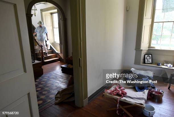Visitor descends a staircase at the Ben Lomond Plantation that recreates a Civil War field hospital on Thursday June 14, 2018 in Manassas, VA. The...