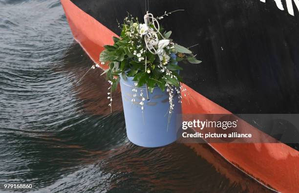 January 2018, Germany, Strande: An urn is let down to the water during a sea burial. According to an estimate by the Association of German Funeral...