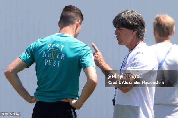 Head coach Joachim Loew talks to Julian Draxler during a Germany training session during the 2018 FIFA World Cup at Park Arena Training Ground on...