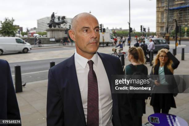 Roger Burnley, chief executive officer of Asda Stores Ltd., arrives for a Department for Environment, Food and Rural Affairs committee hearing at...