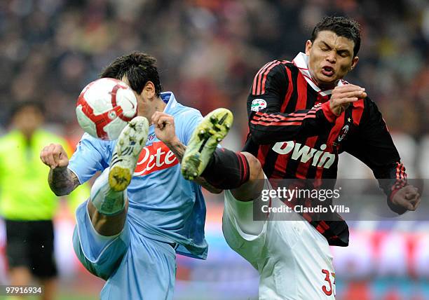 Thiago Silva of AC Milan competes for the ball with Ezequiel Lavezzi of SSC Napoli during the Serie A match between AC Milan and SSC Napoli at Stadio...