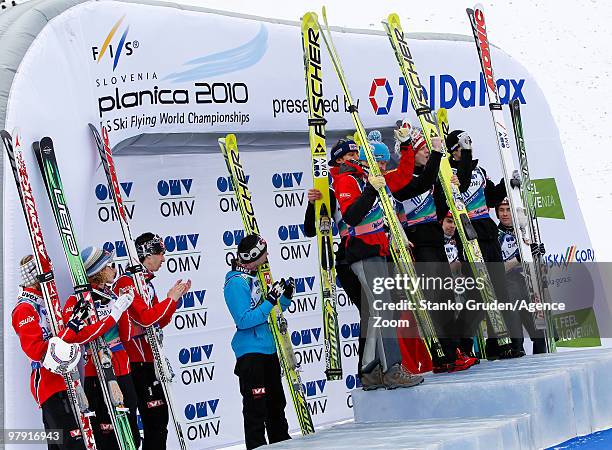 The Norwegian team takes the silver medal, the Austrian team takes the gold medal, and the Finnish team takes the bronze medal during the FIS Ski...