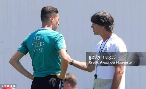 Head coach Joachim Loew talks to Julian Draxler during a Germany training session during the 2018 FIFA World Cup at Park Arena Training Ground on...