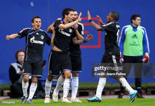 Kevin Kuranyi of Schalke celebrates with his team mates after scoring his team's second goal during the Bundesliga match between Hamburger SV and FC...