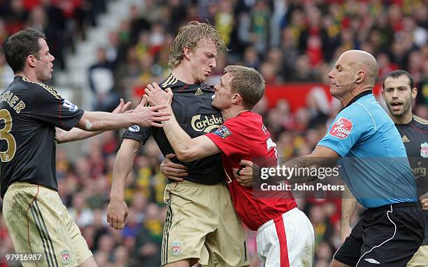 Darren Fletcher of Manchester United clashes with Dirk Kuyt of Liverpool during the FA Barclays Premier League match between Manchester United and...