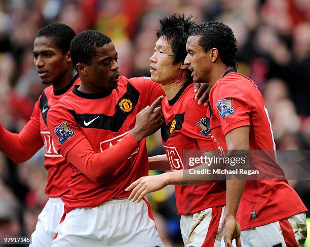 Ji-Sung Park of Manchester United celebrates with team mates Antonio Valencia, Patrice Evra and Nani after scoring the winning goal during the...