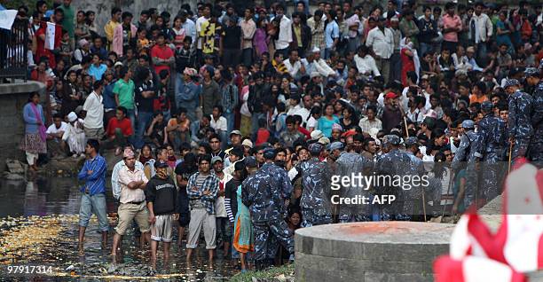 Nepalese people wait gather for the funeral procession of Nepali Congress party president and former prime minister Girija Prasad Koirala in...