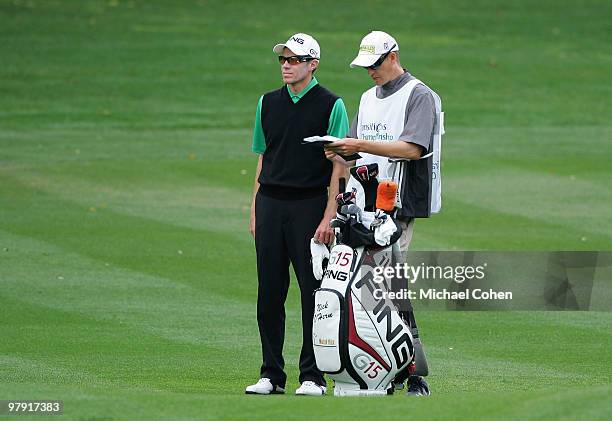 Nick O'Hern of Australia stands by his bag on the first fairway during the final round of the Transitions Championship at the Innisbrook Resort and...