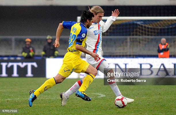 Maxi Lopez of Catania and Mario Yepes of Chievo compete for the ball during the Serie A match between AC Chievo Verona and Catania Calcio at Stadio...