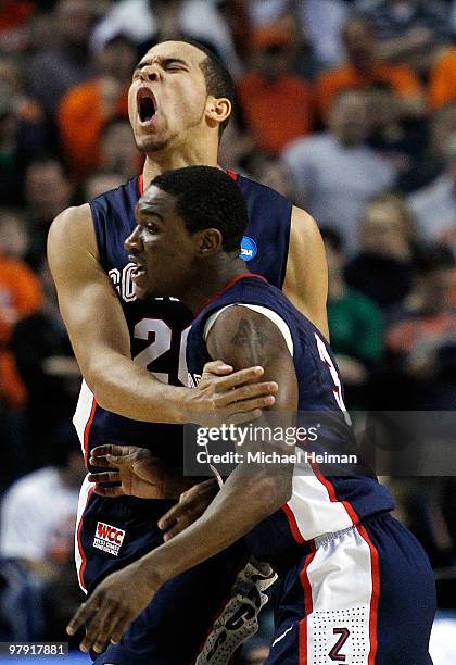 Elias Harris of the Gonzaga Bulldogs reacts after a basket with teammate Demetri Goodson of the Syracuse Orange during the second round of the 2010...