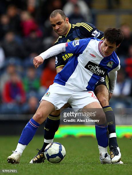 Nikola Kalinic of Blackburn Rovers tussles for posession with Alex of Chelsea during the Barclays Premier League match between Blackburn Rovers and...