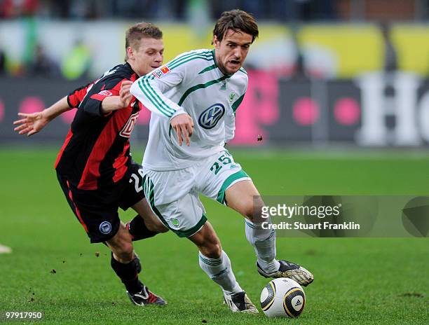 Christian Gentner of Wolfsburg and Lukasz Piszczek of Berlin battle for the ball during the Bundesliga match between VfL Wolfsburg and Hertha BSC...