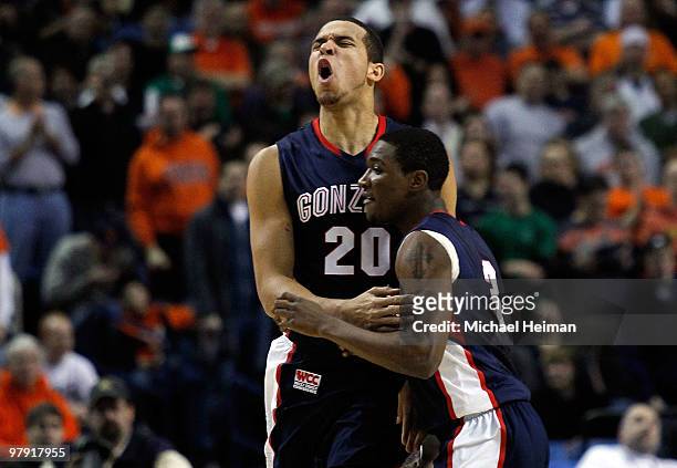 Elias Harris of the Gonzaga Bulldogs reacts after a basket with teammate Demetri Goodson of the Syracuse Orange during the second round of the 2010...