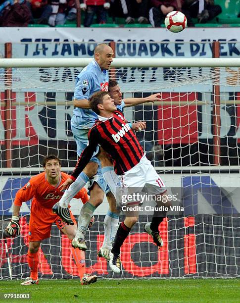 Klaas-Jan Huntelaar of AC Milan competes for the ball with Paolo Cannavaro of SSC Napoli during the Serie A match between AC Milan and SSC Napoli at...