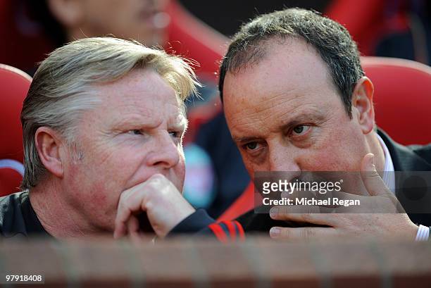 Liverpool manager Rafael Benitez talks to his assistant Sammy Lee during the Barclays Premier League match between Manchester United and Liverpool at...