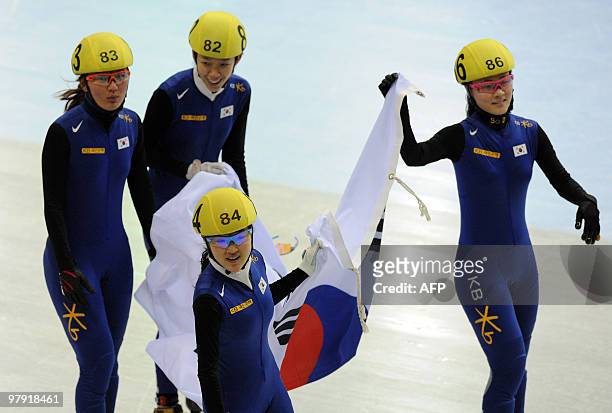South Korea's team Seung-Hi PARK, Ha-Ri CHO, Eun-Byul LEE and team mate celebrate after winning the women's 3000m short-track relay final at the 2010...