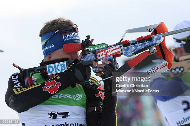 Andreas Birnbacher of Germany shoots during the men's mass start in the E.On Ruhrgas IBU Biathlon World Cup on March 21, 2010 in Oslo, Norway.