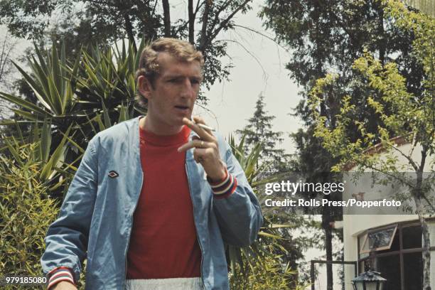 English football goalkeeper Alex Stepney of the England national football team squad relaxes with a cigarette in the grounds of the team's hotel in...