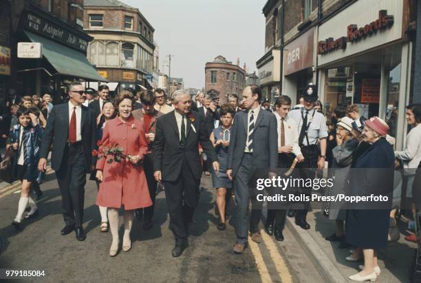 British Labour Party politician and Prime Minister of the United Kingdom, Harold Wilson pictured with his wife Mary Wilson as they campaign on the...