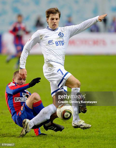 Pavel Mamaev of PFC CSKA Moscow battles for the ball with Kirill Kombarov of FC Dynamo Moscow during the Russian Football League Championship match...