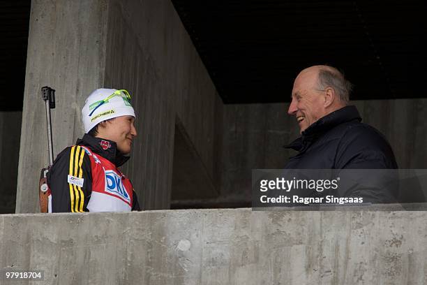 Simone Hauswald of Germany speaks to King Harald V of Norway after winning the Women's 12.5km Mass Start on March 21, 2010 in Holmenkollen, Norway.