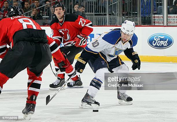 Andy McDonald of the St. Louis Blues skates against the New Jersey Devils at the Prudential Center on March 20, 2010 in Newark, New Jersey. The Blues...