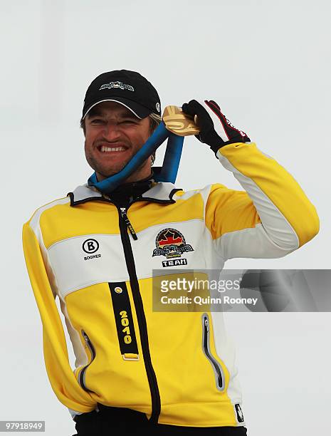 Gold medalist Gerd Schonfelder of Germany celebrates at the medal ceremony for the Men's Standing Super Combined during Day 9 of the 2010 Vancouver...