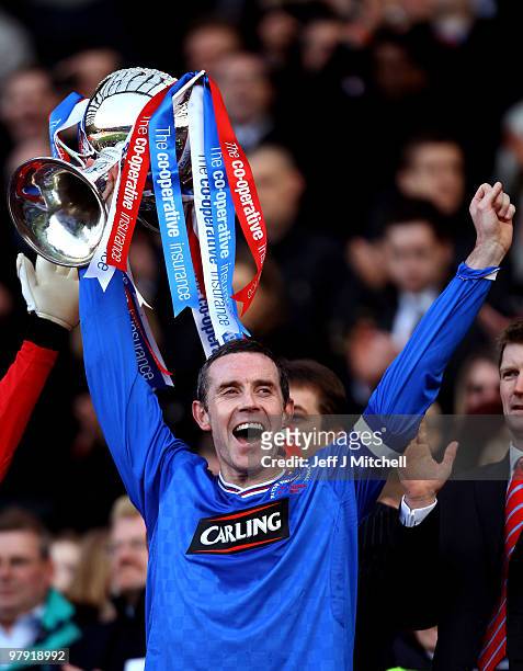 Rangers captain David Weir lifts the CIS Insurance Cup after beating St Mirren 1-0 in the final at Hampden Park on March 21, 2010 in Glasgow,...