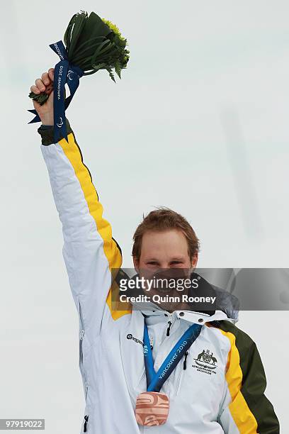 Bronze medalist Cameron Rahles-Rahbula of Australia celebrates at the medal ceremony for the Men's Standing Super Combined during Day 9 of the 2010...