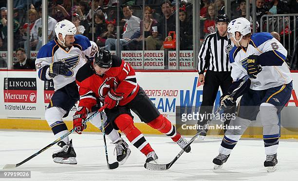 Cam Janssen and Erik Johnson of the St. Louis Blues defend against Ilya Kovalchuk of the New Jersey Devils at the Prudential Center on March 20, 2010...