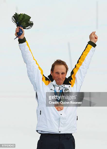 Bronze medalist Cameron Rahles-Rahbula of Australia celebrates at the medal ceremony for the Men's Standing Super Combined during Day 9 of the 2010...
