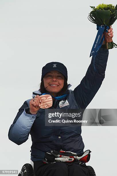 Bronze medalist Alana Nichols of USA celebrates at the medal ceremony for the Women's Sitting Super Combined during Day 9 of the 2010 Vancouver...