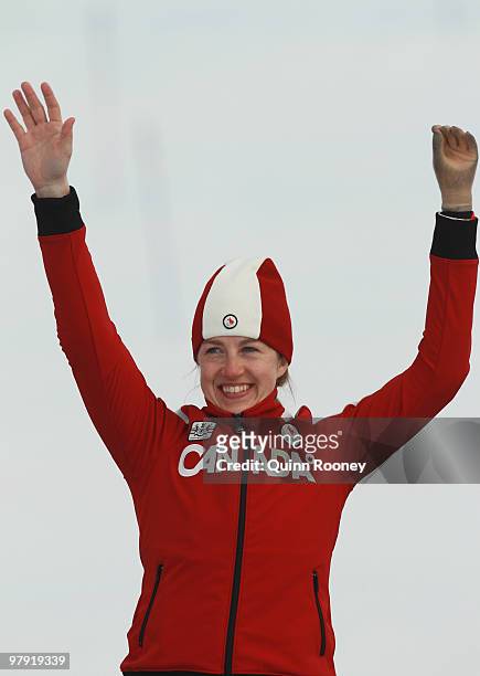 Gold medalist Lauren Woolstencroft of Canada celebrates at the medal ceremony for the Women's Standing Super Combined during Day 9 of the 2010...