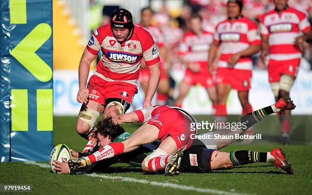 Lee Dickson of Northampton breaks the tackle of Rory Lawson of Gloucester to score during the LV Anglo Welsh Cup Final between Gloucester and...