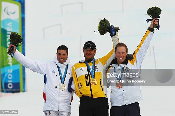 Gold medalist Gerd Schonfelder of Germany celebrates with silver medalist Vincent Gauthier-Manuel of France and bronze medalist Cameron...