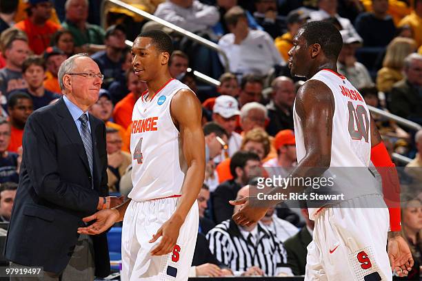 Head coach Jim Boeheim of the Syracuse Orange greets Wes Johnson and Rick Jackson as they come out of the game against the Gonzaga Bulldogs during...