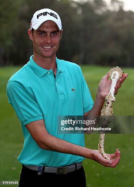 Rhys Davies of Wales poses with the winners trophy after the final round of the Hassan II Golf Trophy at Royal Golf Dar Es Salam on March 21, 2010 in...