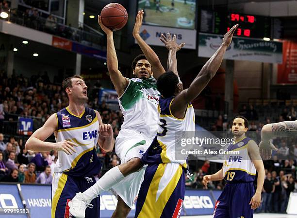 Chris Copeland of Trier and by Marko Scekic as well as Rickey Paulding of Oldenburg during the Beko BBL basketball match between TBB Trier and EWE...