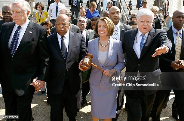 Speaker of the House Rep. Nancy Pelosi carries the gavel that was used when Medicare was passed by the House in the 1960s while marching with...