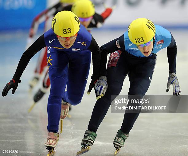 Seung-Hi Park of South Korea and Katherine Reutter of the US compete during the women's 3000m short-track super final at the 2010 World Short Track...