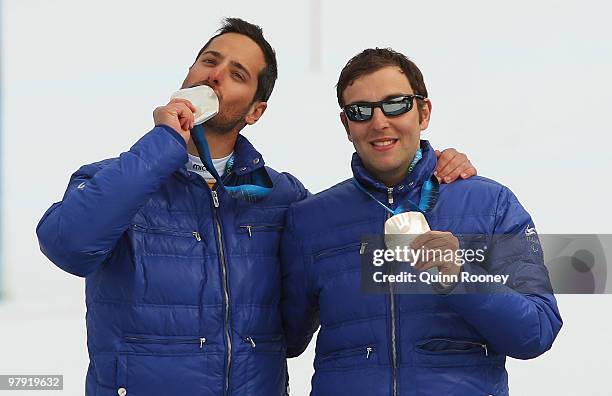 Silver medalist Gianmaria Dal Maistro of Italy and guide Tommaso Balasso celebrate at the medal ceremony for the Men's Visually Impaired Super...