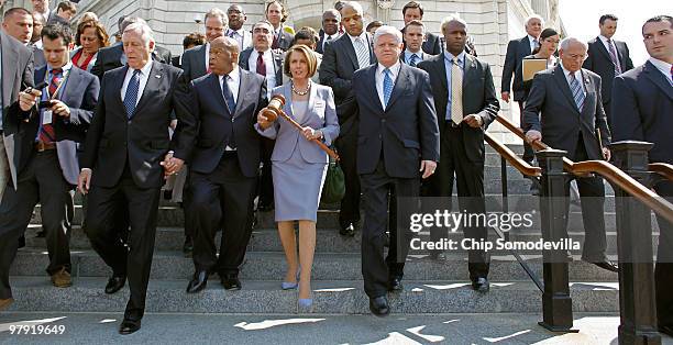 Speaker of the House Rep. Nancy Pelosi carries the gavel that was used when Medicare was passed by the House in the 1960s while marching with...