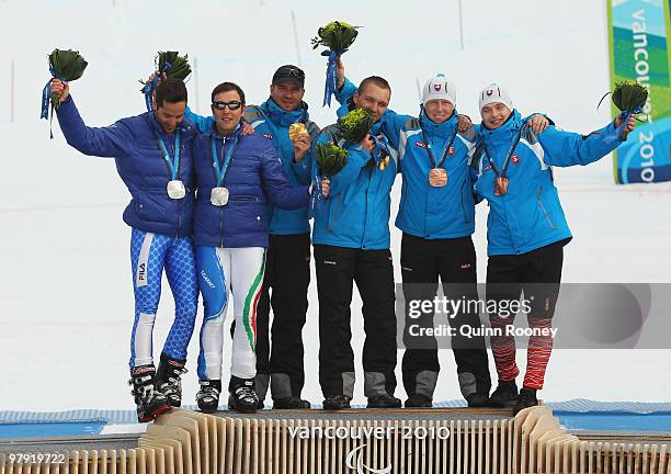 Silver medalist Gianmaria Dal Maistro of Italy and guide Tommaso Balasso, gold medalist Jakub Krako of Slovakia and guide Juraj Medera and bronze...