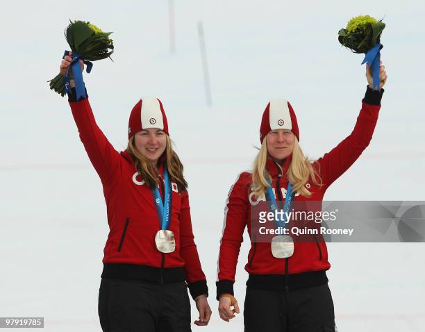 Silver medalist Viviane Forest of Canada and guide Lindsay Debou celebrate at the medal ceremony for the Women's Visually Impaired Super Combined...