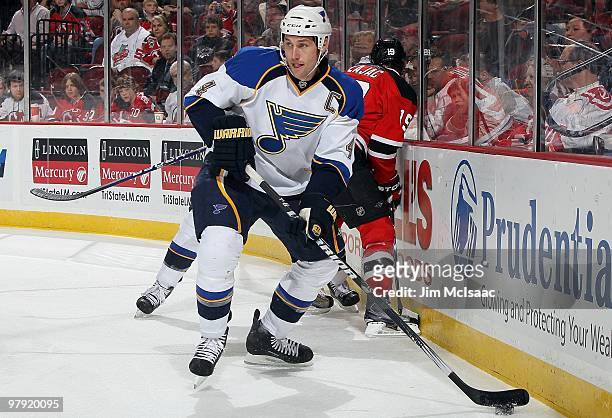 Eric Brewer of the St. Louis Blues skates against the New Jersey Devils at the Prudential Center on March 20, 2010 in Newark, New Jersey. The Blues...