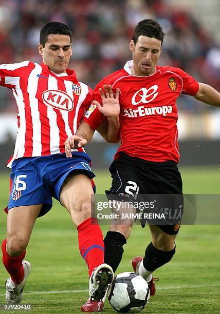 Mallorca's forward Aritz Aduriz vies with Atletico Madrid's defender Juanito Gutierrez during their Spanish league football match on March 21, 2010...