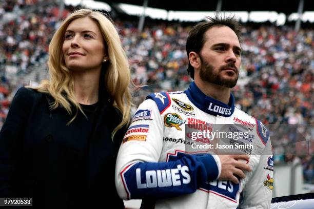 Jimmie Johnson , driver of the Lowe's Chevrolet, stands on the grid with his wife Chandra prior to the start during the NASCAR Sprint Cup Series Food...