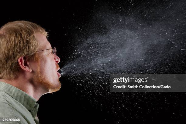 Man sneezing, depicted in a high-speed camera image, 2009. Image courtesy Centers for Disease Control / Brian Judd.