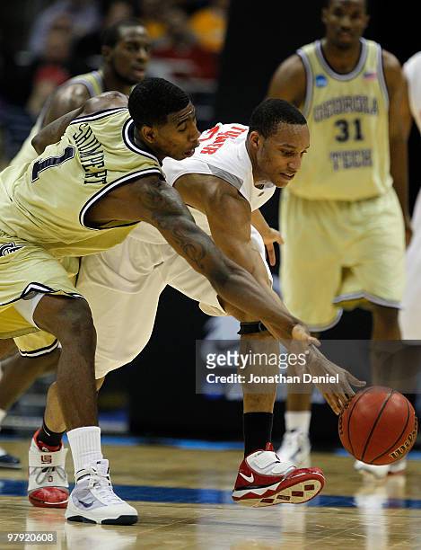 Iman Shumpert of the Georgia Tech Yellow Jackets and Evan Turner of the Ohio State Buckeyes go after a loose ball during the second round of the 2010...